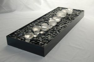 Evidence of Morning: cast glass “dew drops”, river rocks, steel box